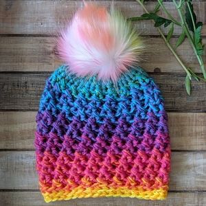 Bright neon colorful hat with rainbow pompom